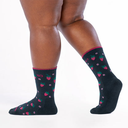 Model walking to the left with back foot lifted wearing the strawberry fields cushioned crew in eclipse