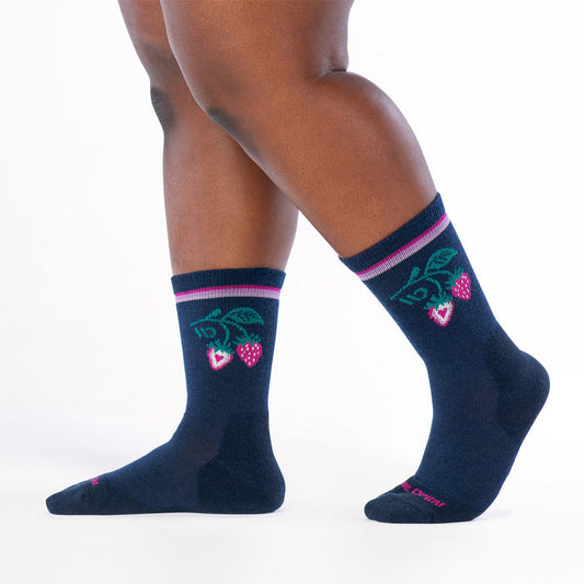 model walking to the left wearing the strawberry patch cushioned crew in eclipse
