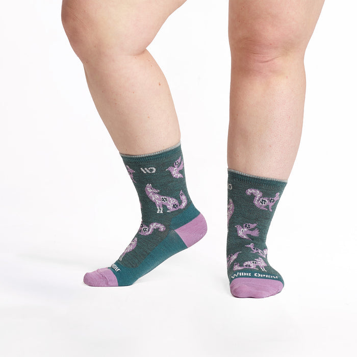 models feet with left foot lifted wearing the 9516 woodland wonder micro crew in teal